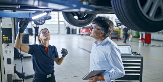 two people in an automotive setting
