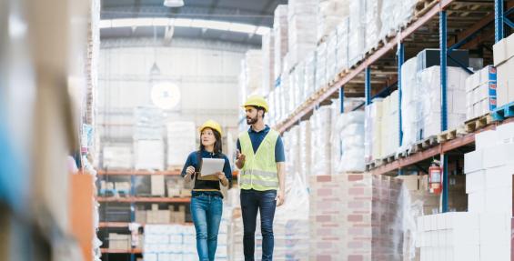 two people in a manufacturing warehouse