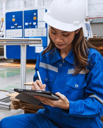 person holding a clipboard conducting a hazard assessment 