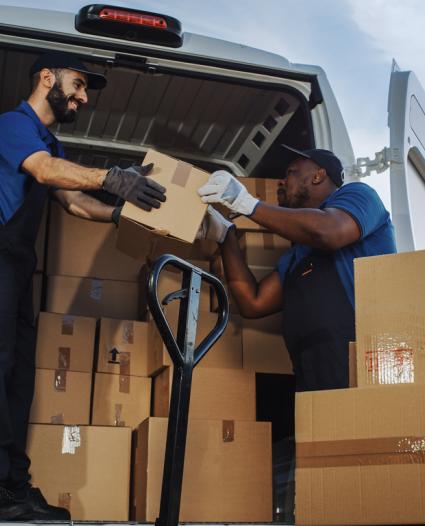 two people unloading a truck