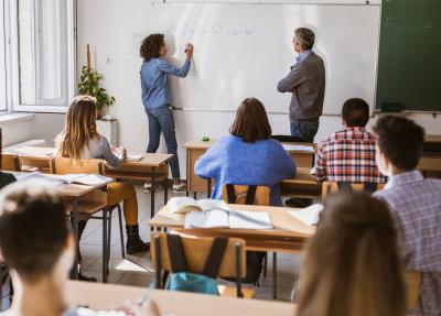 students and a teacher in a classroom